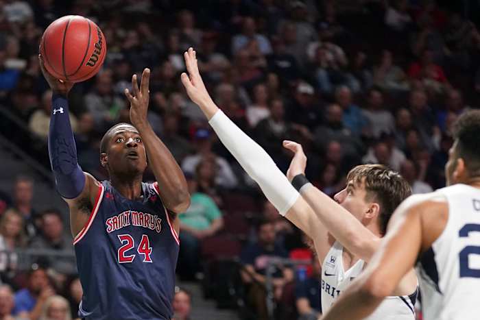 March 9, 2020; Las Vegas, NV, USA; Saint Mary's Gaels forward Malik Fitts (24) shoots the basketball against BYU Cougars guard Zac Seljaas (2) during the first half during the semifinal game in the WCC Basketball Championships at Orleans Arena. Mandatory Credit: Kyle Terada-USA TODAY Sports